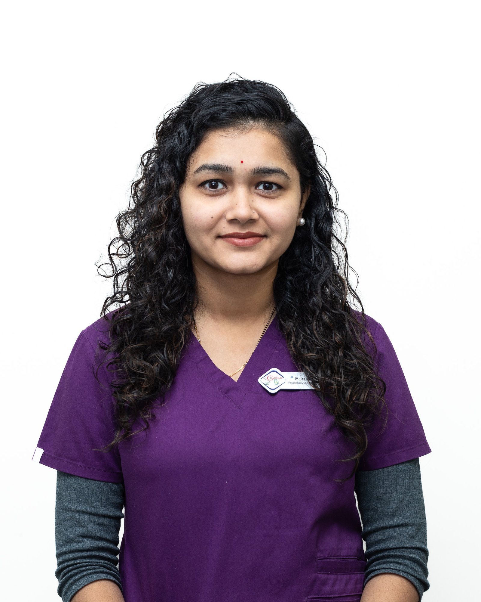 Professional headshot of a team member on a white backdrop
