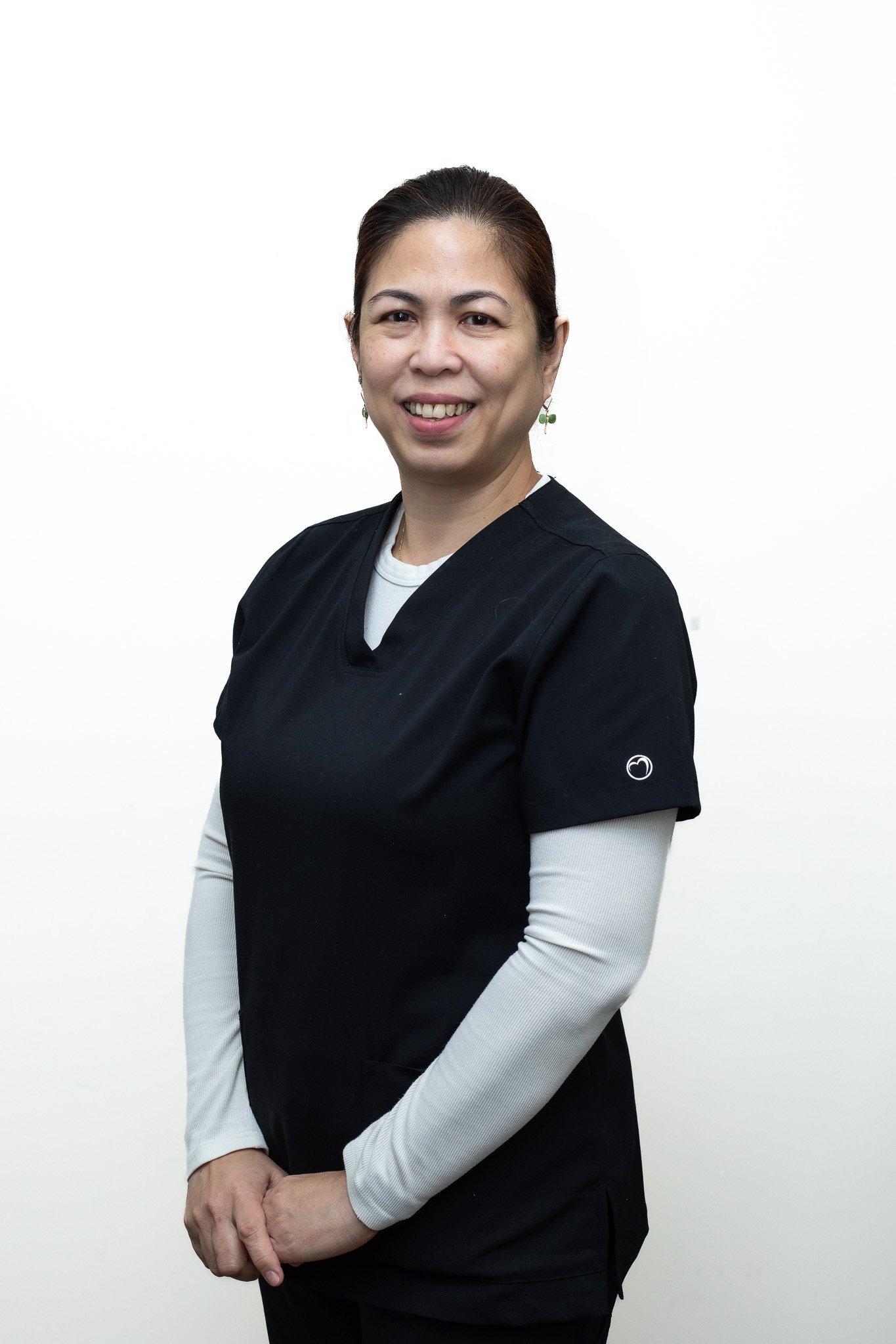 Smiling team member headshot on a white backdrop