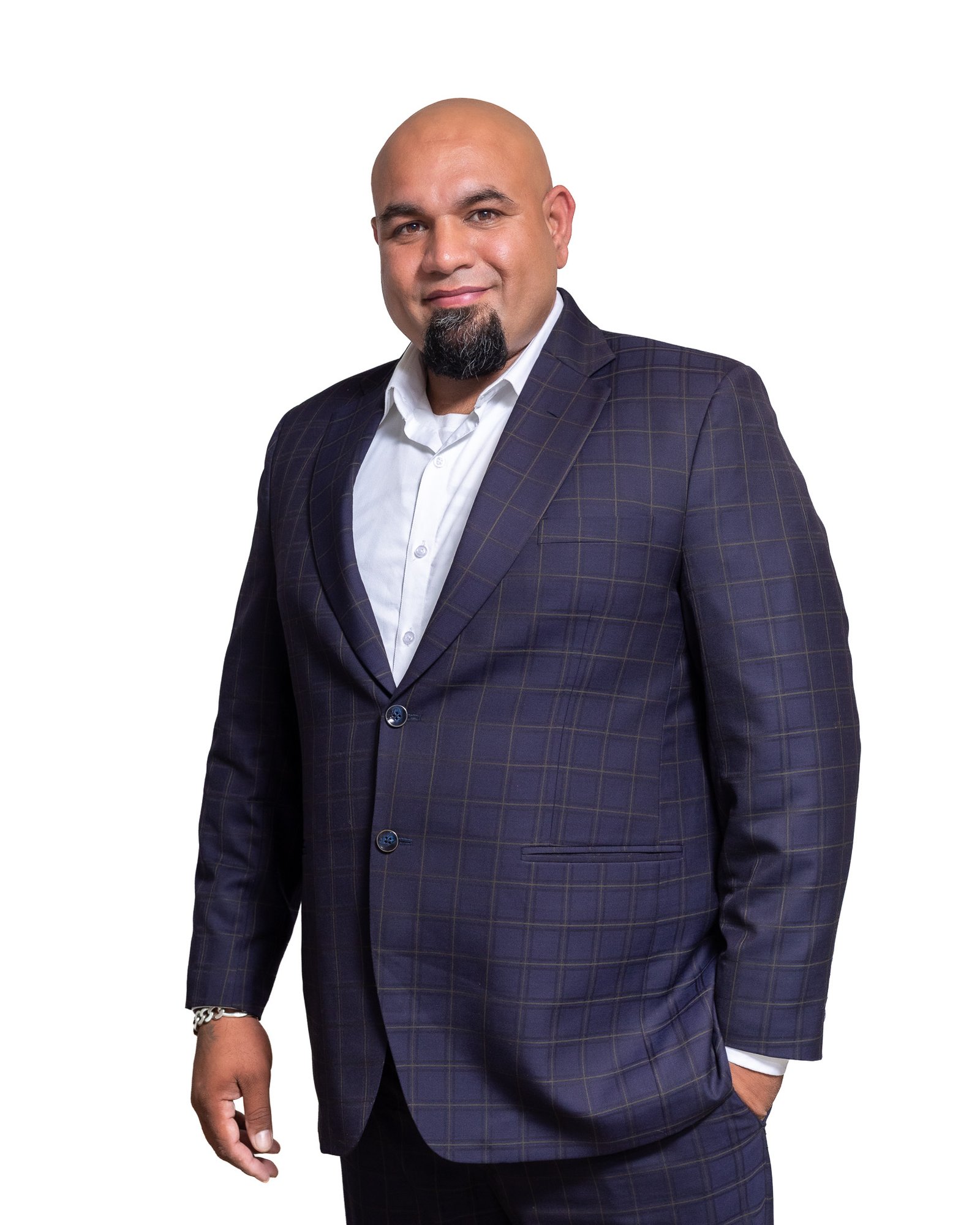 Executive headshot of a man in a checked suit